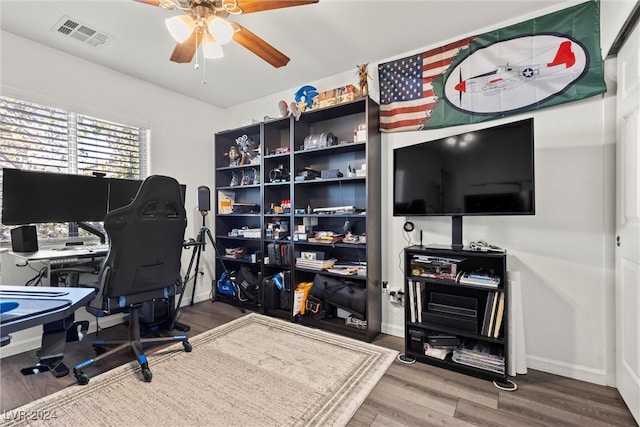 home office featuring hardwood / wood-style flooring and ceiling fan