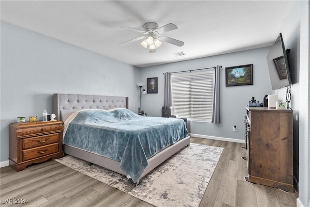 bedroom featuring ceiling fan and light hardwood / wood-style flooring