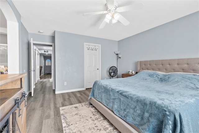 bedroom featuring hardwood / wood-style flooring and ceiling fan