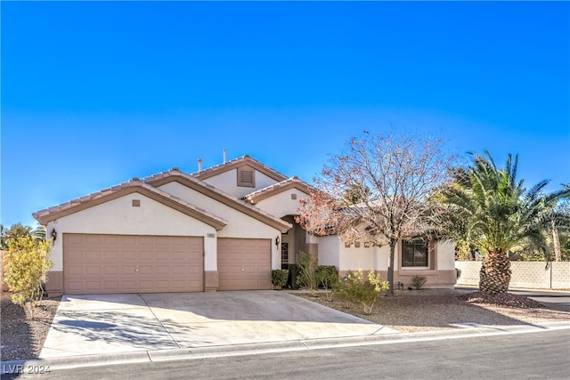 mediterranean / spanish-style house featuring a garage