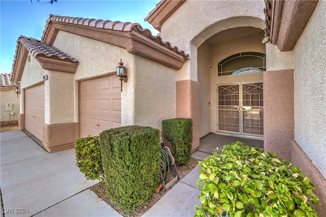 property entrance featuring a garage