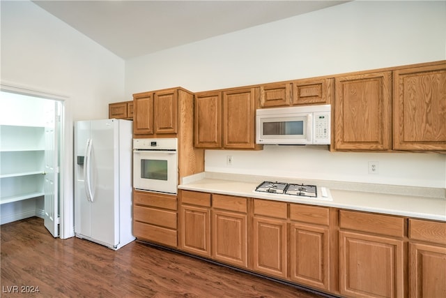 kitchen featuring dark hardwood / wood-style flooring, high vaulted ceiling, and white appliances