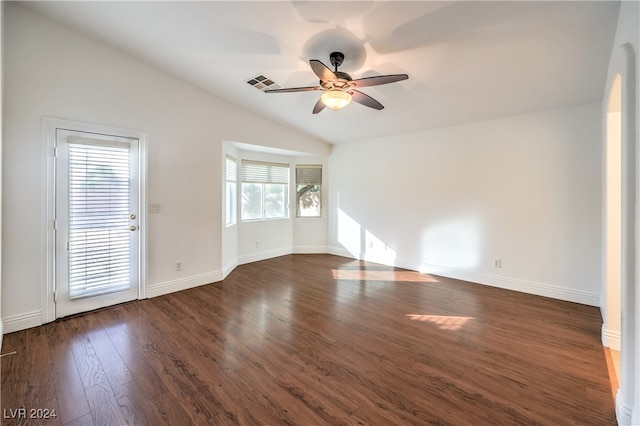 empty room featuring ceiling fan, dark hardwood / wood-style flooring, and lofted ceiling