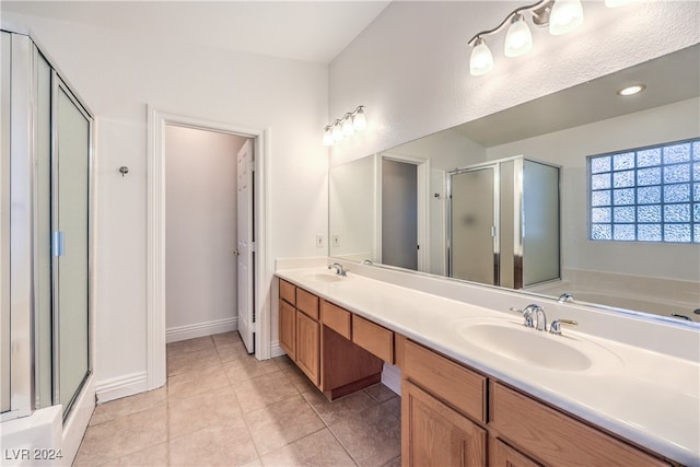 bathroom featuring tile patterned floors, vanity, and plus walk in shower