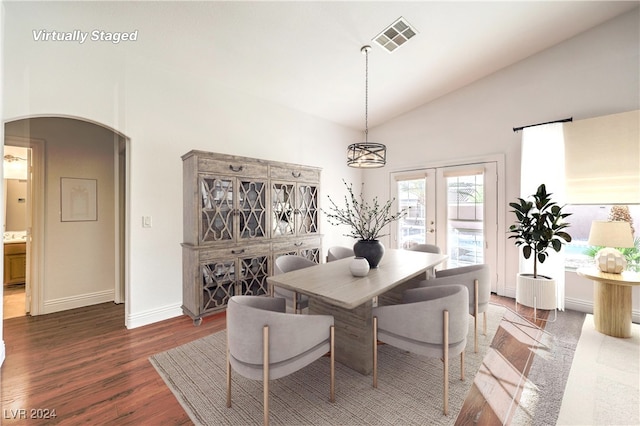 dining space featuring french doors, dark hardwood / wood-style floors, and high vaulted ceiling