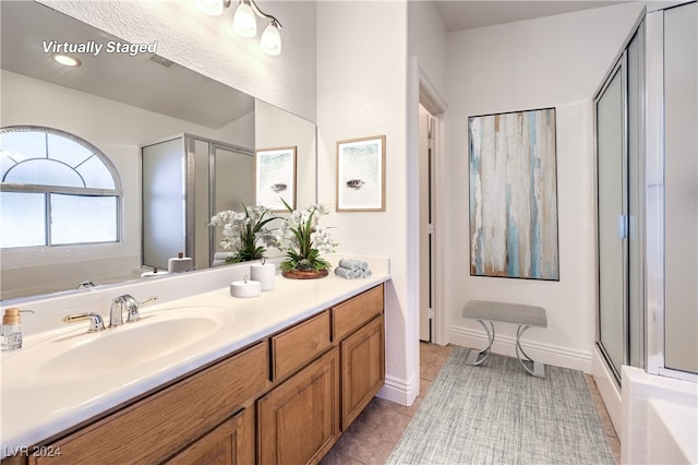 bathroom featuring tile patterned floors, vanity, and independent shower and bath