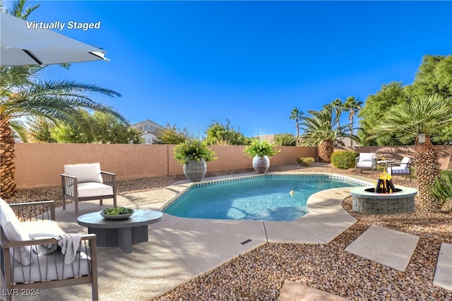 view of swimming pool with a patio area