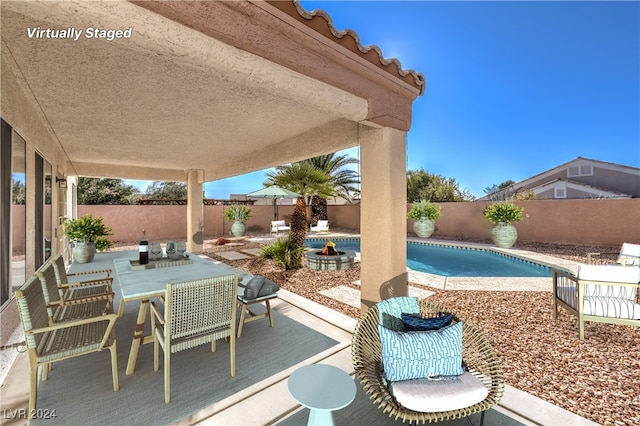 view of patio / terrace featuring a fenced in pool