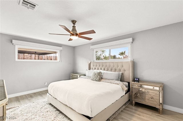 bedroom featuring light hardwood / wood-style floors and ceiling fan