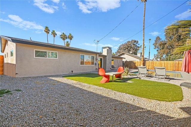 back of property with a patio