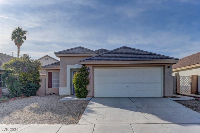 ranch-style house featuring a garage