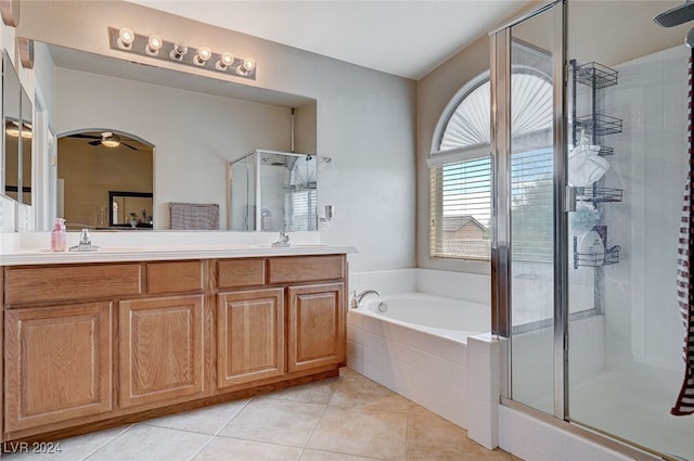 bathroom with ceiling fan, tile patterned flooring, vanity, and shower with separate bathtub