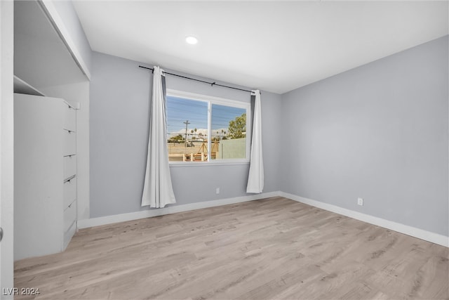 empty room with light hardwood / wood-style floors