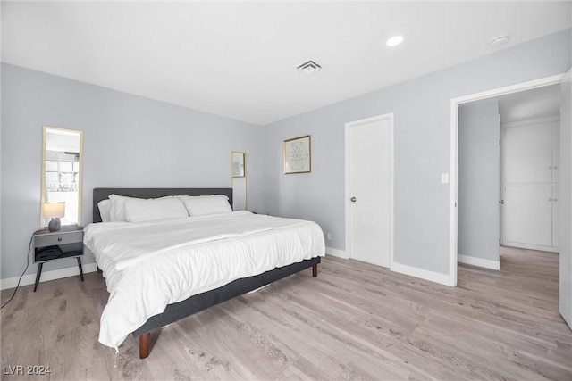 bedroom with light wood-type flooring