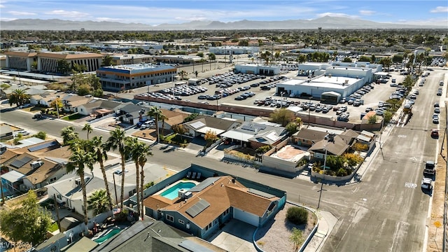 birds eye view of property featuring a mountain view