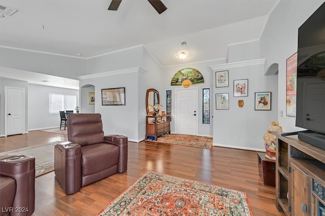 living room featuring wood-type flooring, ceiling fan, and lofted ceiling