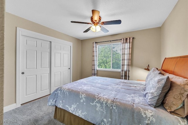 carpeted bedroom with ceiling fan and a closet