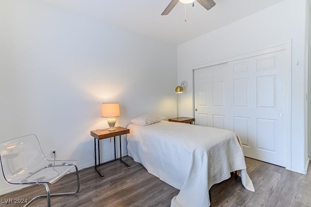 bedroom with hardwood / wood-style flooring, a closet, and ceiling fan