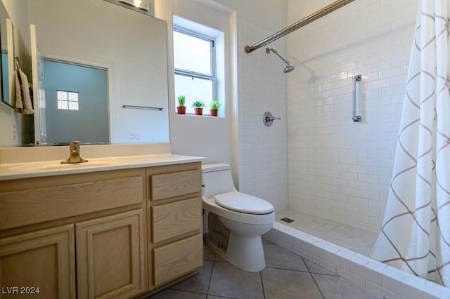 bathroom featuring a shower with curtain, tile patterned floors, vanity, and toilet