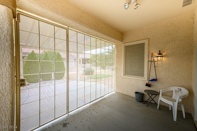 unfurnished sunroom with a healthy amount of sunlight