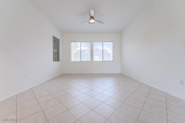 unfurnished room featuring ceiling fan and light tile patterned floors