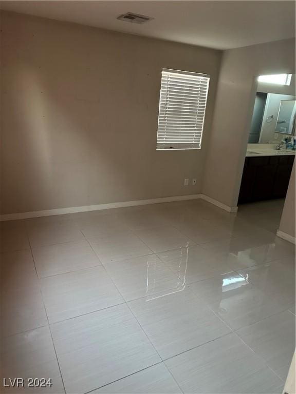 spare room with light tile patterned floors