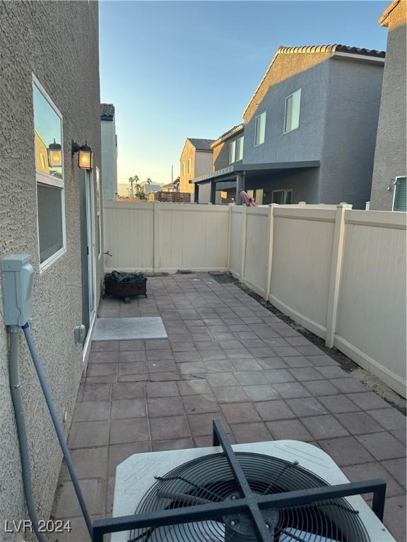 view of patio terrace at dusk