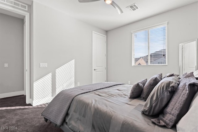 bedroom featuring ceiling fan and carpet