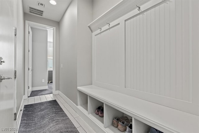 mudroom with light tile patterned flooring