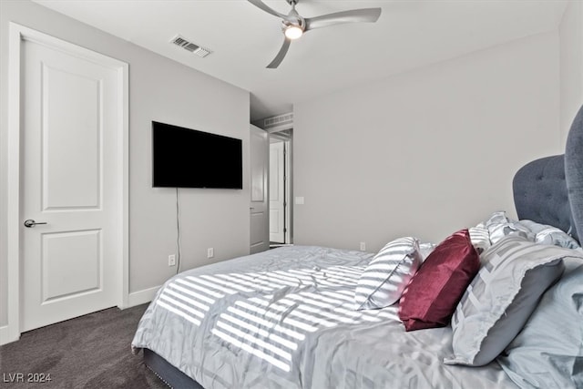 bedroom featuring ceiling fan and dark colored carpet