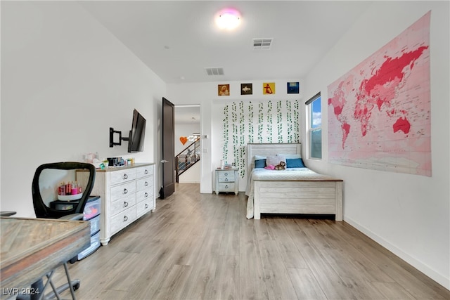 bedroom with light hardwood / wood-style floors