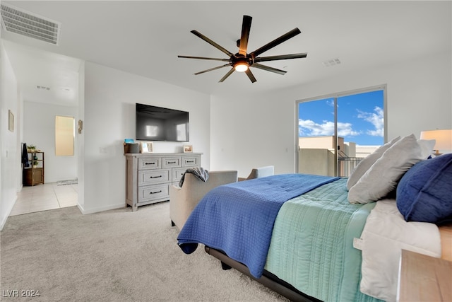 bedroom featuring access to outside, ceiling fan, and light colored carpet