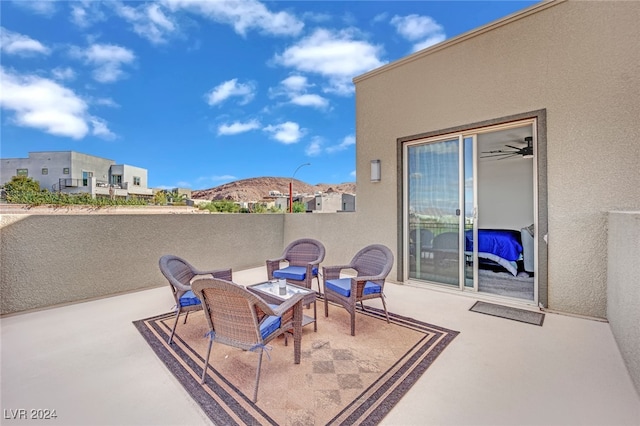 view of patio / terrace featuring a mountain view