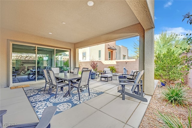 view of patio with a fire pit