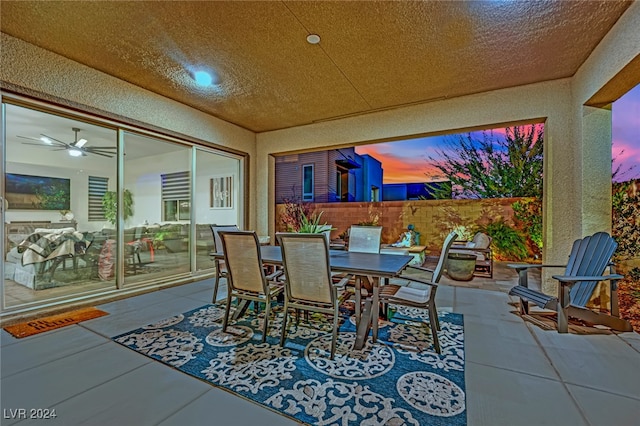 patio terrace at dusk with ceiling fan