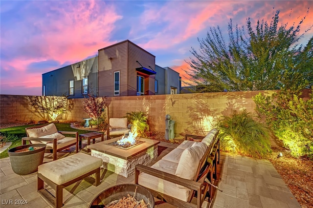 patio terrace at dusk with an outdoor fire pit