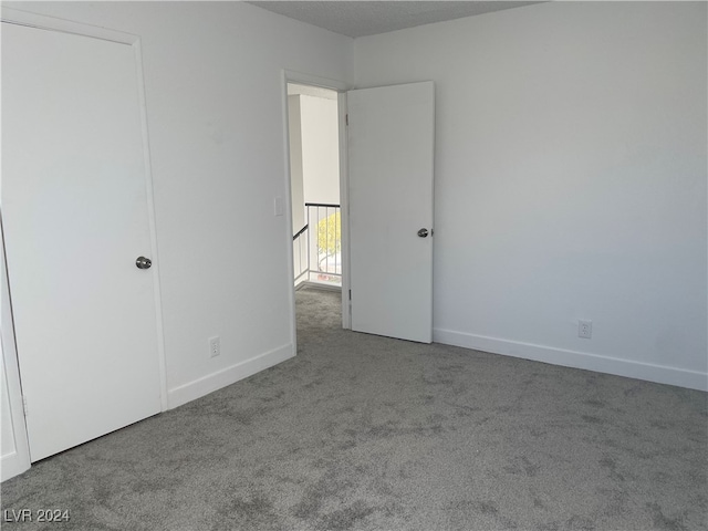 unfurnished bedroom with carpet