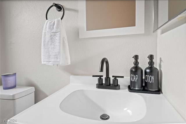 bathroom featuring sink and toilet