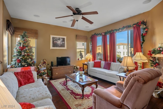 living room featuring dark hardwood / wood-style flooring and ceiling fan