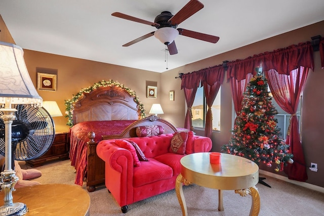 bedroom featuring light carpet and ceiling fan