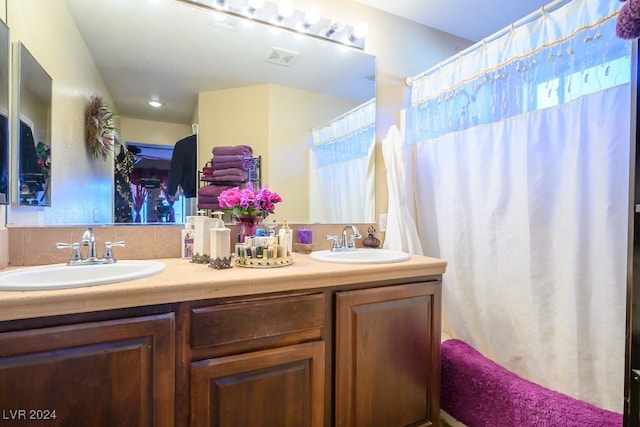 bathroom with vanity and walk in shower