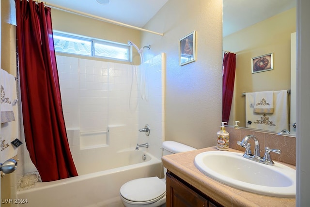 full bathroom featuring shower / bath combo, toilet, and vanity