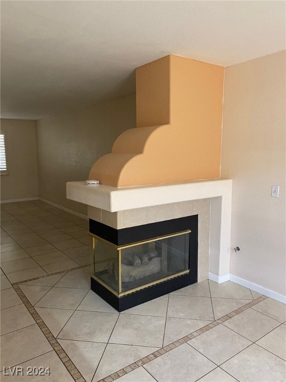 room details with tile patterned floors and a fireplace