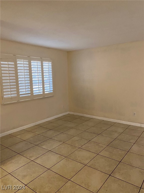 spare room with light tile patterned floors