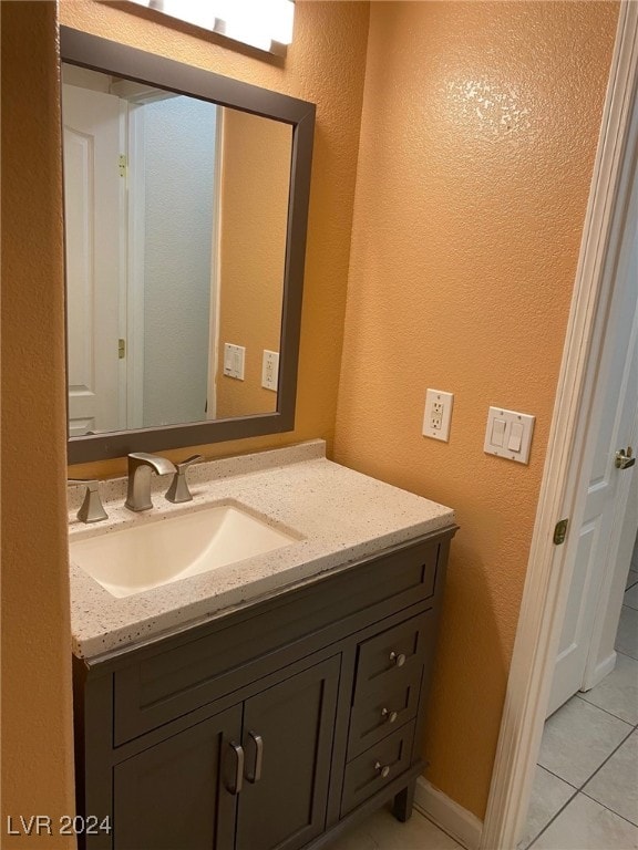 bathroom featuring tile patterned floors and vanity