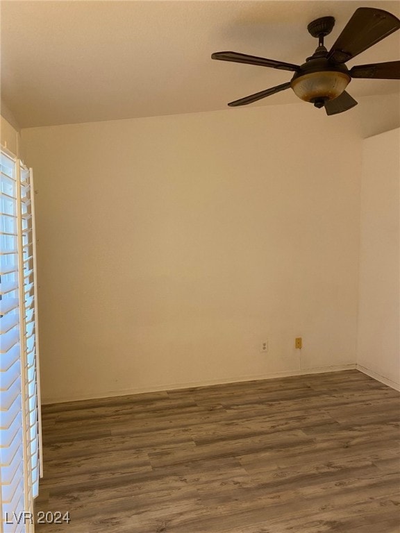 empty room featuring wood-type flooring and ceiling fan