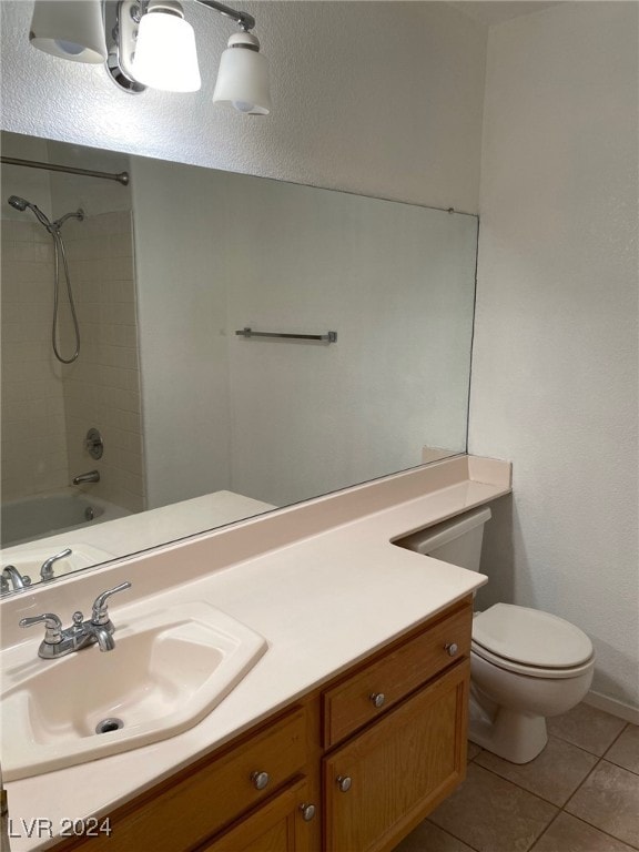 full bathroom featuring tile patterned floors, vanity, shower / bathtub combination, and toilet