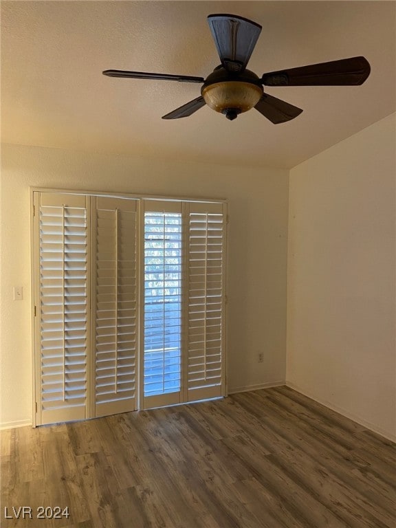 empty room featuring ceiling fan and wood-type flooring