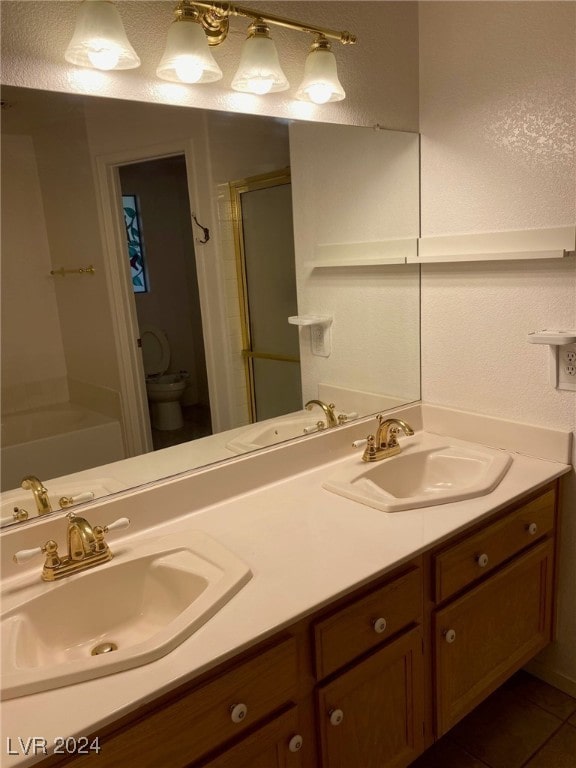 bathroom featuring walk in shower, tile patterned floors, vanity, and toilet