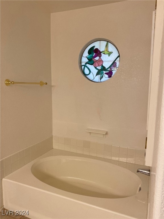 bathroom with a washtub